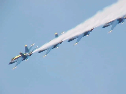 Blue Angels flying across the sky