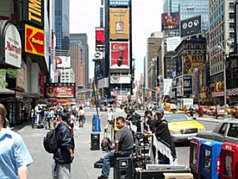 Times Square. Busy with people and signs and billboards and cars.