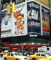 Side of the building with big Broadway posters. Kiss Me Kate, Cabaret, Riverdance & The Full Monty.