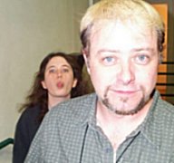 Pic: Buz the stage manager faces the camera while Laura Fitzsimmons the ASM stands behind him sticking her tongue out at him.
