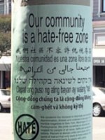 This is a sign on a pole that says, Our community is a hate-free zone.