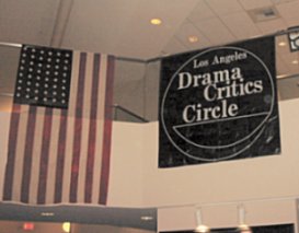 American flag hanging next to a Los Angeles Drama Critics Circle banner