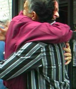 Brian Stokes Mitchell hugs Steve Schalchlin