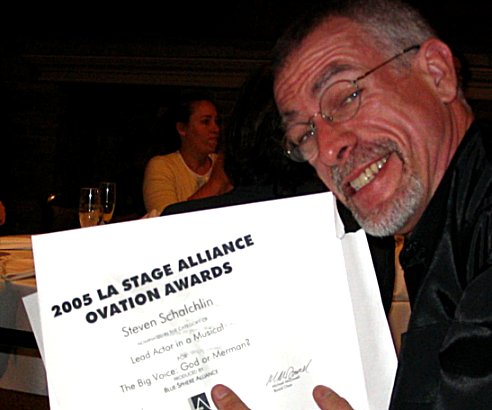 Steve Schalchlin holds up his best actor award